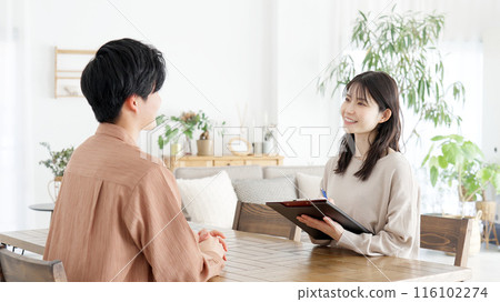 Woman interviewing a man Woman interviewing a man 116102274