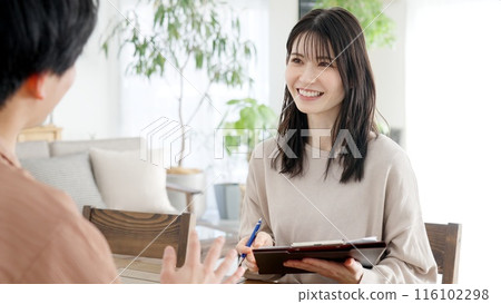Woman interviewing a man 116102298