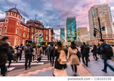 Tokyo cityscape in Japan Tokyo Station Marunouchi North Exit. People heading to the station after finishing work. In the back are office buildings in Marunouchi Tokyo cityscape in Japan Tokyo Station Marunouchi North Exit. People heading to the station after finishing work. In the back are office buildings in Marunouchi 116103330