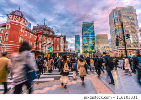 Tokyo cityscape in Japan Tokyo Station Marunouchi North Exit. People heading to the station after finishing work. In the back are office buildings in Marunouchi Tokyo cityscape in Japan Tokyo Station Marunouchi North Exit. People heading to the station after finishing work. In the back are office buildings in Marunouchi 116103331