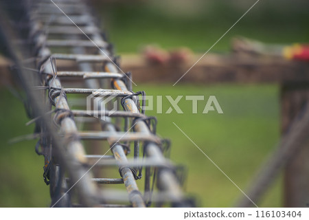 Iron wire reinforcement of concrete work. Construction site objects of bending cutting stainless steel wire fences bar. Civil construction engineering concept. pile of under construction materials 116103404