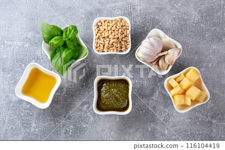 Traditional Italian pesto recipe on a grey stone background. 116104419