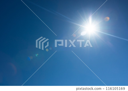 Lens flare effect over deep blue sky with sun Lens flare effect over deep blue sky with sun 116105169
