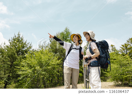 Parents and children enjoying hiking 116106437
