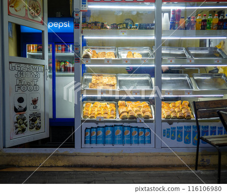 Sales point in Georgia. Street sale of food. Sweets stall. Local pastries. Fast food point. caloric food Sales point in Georgia. Street sale of food. Sweets stall. Local pastries. Fast food point. caloric food 116106980