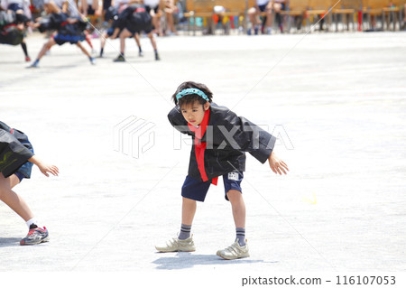 A boy shows off the dance he has practiced at his elementary school's sports day A boy shows off the dance he has practiced at his elementary school's sports day 116107053
