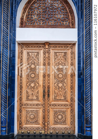 Wooden door with carved pattern Uzbek ornament in Museum of Victims of Political Repression in Uzbekistan Wooden door with carved pattern Uzbek ornament in Museum of Victims of Political Repression in Uzbekistan 116107972