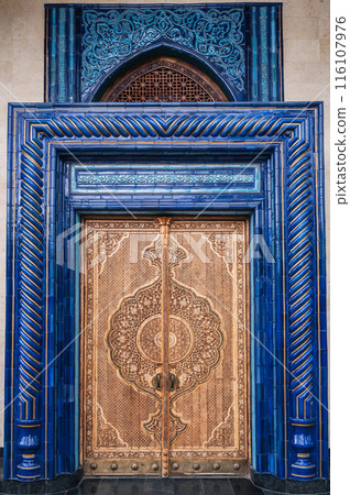 Wooden carved door with oriental pattern Uzbek ornament in the Museum of Victims of Political Repression in Tashkent 116107976