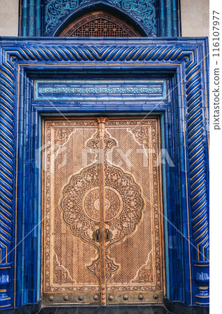 Wooden door with carved oriental pattern Uzbek ornament in Museum of Victims of Political Repression in Tashkent 116107977