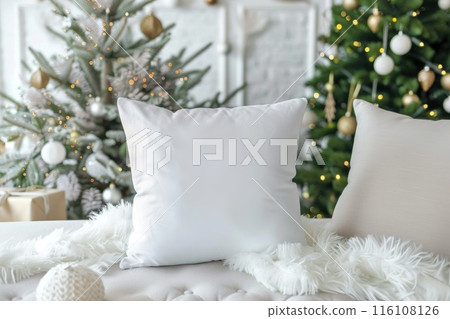 Cozy White Pillow on Fur Blanket with Christmas Tree Lights Background Cozy White Pillow on Fur Blanket with Christmas Tree Lights Background 116108126