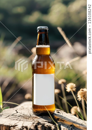 Cold Beer Bottle with Blank Label on Rustic Wooden Surface in Nature 116108242