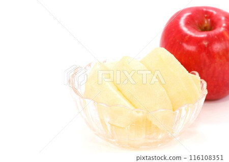 Bright red apple peeled and cut dessert light background Bright red apple peeled and cut dessert light background 116108351