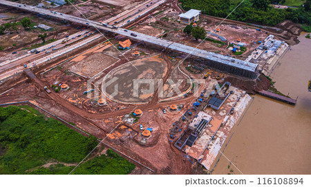 Aerial view of the construction site of the bridge over the Mekong River. Construction of a new Thai-Lao Friendship Bridge in Bueng Kan Province, Thailand. Aerial view of the construction site of the bridge over the Mekong River. Construction of a new Thai-Lao Friendship Bridge in Bueng Kan Province, Thailand. 116108894