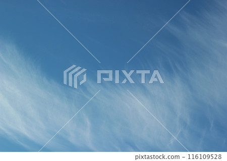 Background featuring a blue sky with winter clouds drifting away in the wind. Background featuring a blue sky with winter clouds drifting away in the wind. 116109528