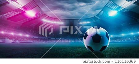3D render. Soccer ball lying on green field in front of large empty open air stadium with neon floodlights. Full tribune of fans 3D render. Soccer ball lying on green field in front of large empty open air stadium with neon floodlights. Full tribune of fans 116110369