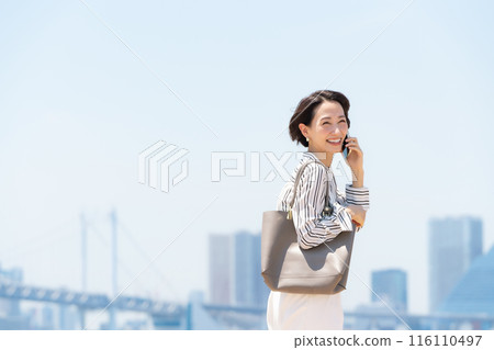 Business city woman smartphone 116110497