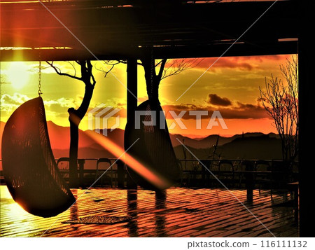 A deck lit up by the sunset 116111132