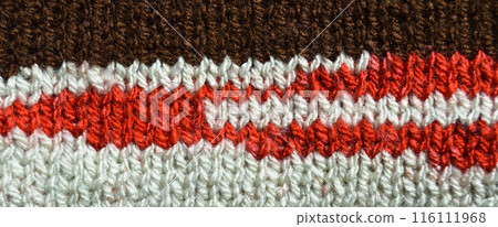 Handmade knitted fabric brown red and beige wool background texture Handmade knitted fabric brown red and beige wool background texture 116111968
