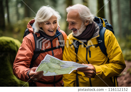 Joyful Senior Couple Browsing Travel Magazine Joyful Senior Couple Browsing Travel Magazine 116112152