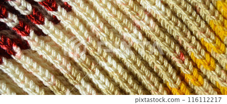 Handmade knitted fabric yellow and red wool background texture 116112217