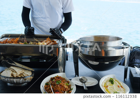 Outdoor Dining Service on a Luxury Yacht 116112338