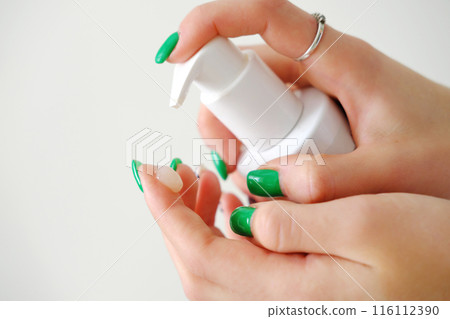 Dispensing Lotion from Bottle to Hand 116112390