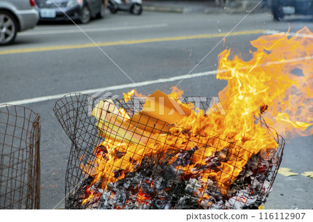 paper money for ghosts, China, religion, Chinese ghost festival, belief, burning paper money, China, Chinese ghost festival, believers, burning paper 116112907