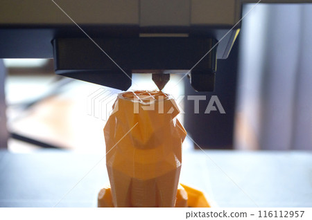 3D printer close-up. The process of working of 3D printer. 3D printer printing object from molten plastic. 3D printer creating model by flowing liquid plastic from an extruder. Printing technology 116112957