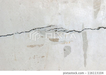 Crack in concrete wall affected with earthquake and collapsed ground 116113104