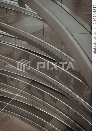 A curved walkway stretches in spirals upwards on top inside the glass dome. 116114813
