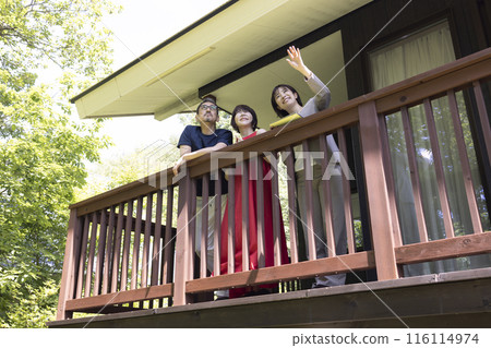 A businessperson giving a tour to a middle-aged couple A businessperson giving a tour to a middle-aged couple 116114974