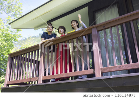 A businessperson giving a tour to a middle-aged couple A businessperson giving a tour to a middle-aged couple 116114975