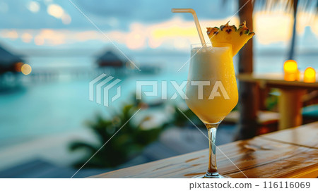 Refreshing pina colada cocktail against amazing beach background with palms and ocean. Summer vacation concept. 116116069