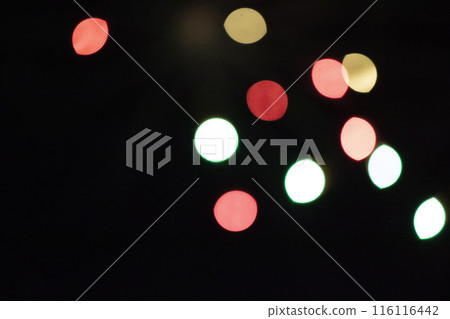 Multicolored bokeh spots on a black background. 116116442