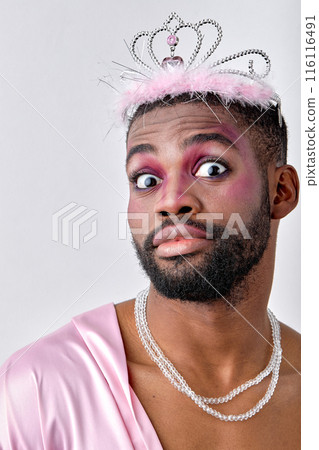 Close-up portrait of young princess man of black american appearance looking surprised Close-up portrait of young princess man of black american appearance looking surprised 116116491