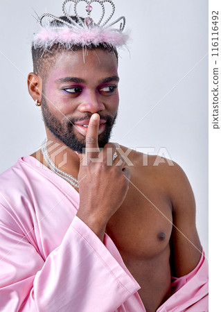Adorable black half-naked man in crown posing at camera like a fairy, princess 116116492