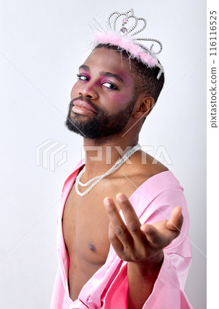 Awesome black half-naked man in crown posing at camera like a fairy, princess 116116525