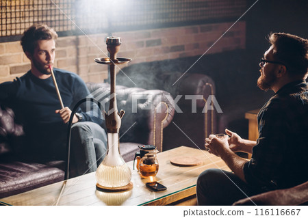 old friends have met at the bar after many years 116116667