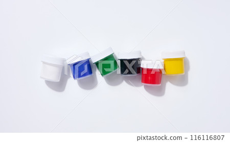 Plastic jars with multi-colored gouache on a white background Plastic jars with multi-colored gouache on a white background 116116807