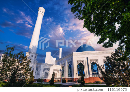 exterior of modern white Islamic Masjid Minor Mosque in Tashkent in Uzbekistan on background of blue sunset sky in summer exterior of modern white Islamic Masjid Minor Mosque in Tashkent in Uzbekistan on background of blue sunset sky in summer 116116973