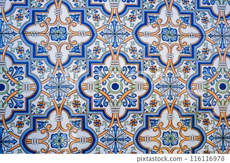ceramic tile with a traditional Uzbek ornament with a oriental pattern. Wall of white mosque Minor in Uzbekistan ceramic tile with a traditional Uzbek ornament with a oriental pattern. Wall of white mosque Minor in Uzbekistan 116116978