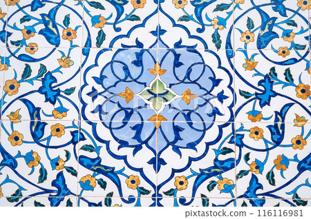 ceramic tile with a traditional Uzbek floral ornament with a pattern of flowers. The wall of white mosque Minor in Tashkent in Uzbekistan ceramic tile with a traditional Uzbek floral ornament with a pattern of flowers. The wall of white mosque Minor in Tashkent in Uzbekistan 116116981