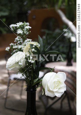 A coffee shop terrace with tables and chairs A coffee shop terrace with tables and chairs 116117444