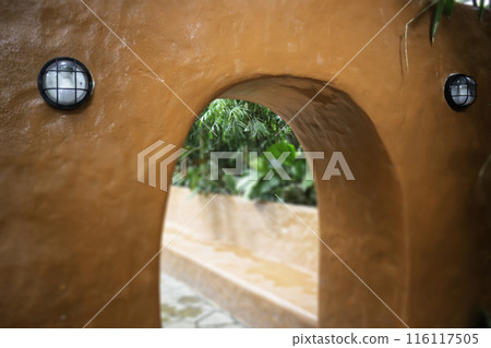 A coffee shop terrace with tables and chairs 116117505
