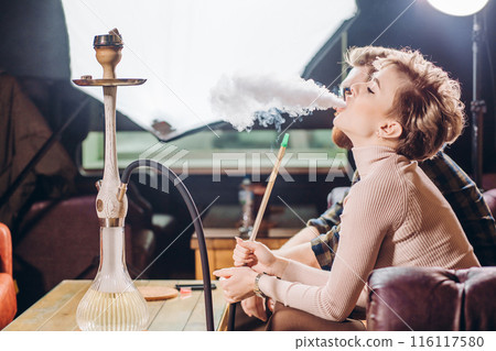 thick smoke of hookah. close up side view shot. 116117580