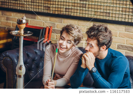 young positive people habing fun at the restaurant young positive people habing fun at the restaurant 116117583