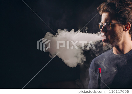 young awesome man is addicted to a hookah 116117606