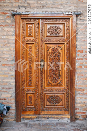 carved wooden doors with tajik carved pattern with Islamic ornament in oriental kandakori style in Tadjikistan carved wooden doors with tajik carved pattern with Islamic ornament in oriental kandakori style in Tadjikistan 116117676