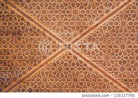 oriental Uzbek Islamic patterns ornament with stars on modern wooden carved door in Uzbekistan oriental Uzbek Islamic patterns ornament with stars on modern wooden carved door in Uzbekistan 116117760