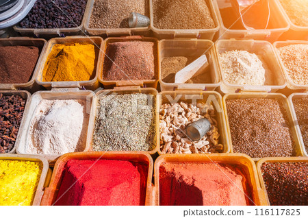 assortment of various oriental spices on counter at bazaar in Uzbekistan 116117825